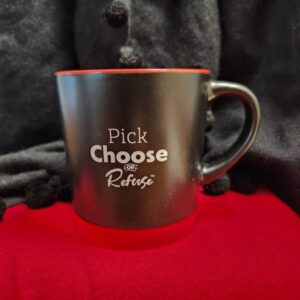 A black ceramic mug with a red interior and base, featuring the words "Pick Choose Refuse" printed in white on the front - The Road Ahead is a Better One A black ceramic mug with a red interior and base, featuring the words "Pick Choose Refuse" printed in white on the front - The Road Ahead is a Better One